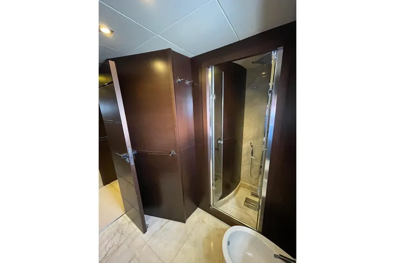 Andea Yacht Photos Pics Luxurious bathroom interior on 2008 Tecnomar Nadara 26 Fly yacht, featuring sleek wood finishes.