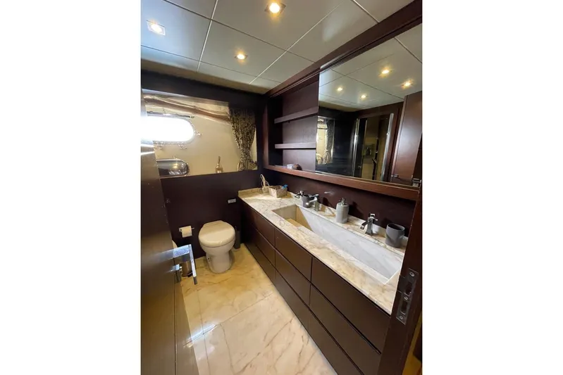 Andea Yacht Photos Pics Luxurious bathroom on 2008 Tecnomar Nadara 26 Fly yacht with marble countertop and modern fixtures.