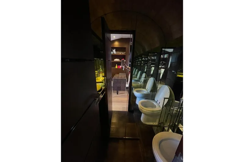 Andea Yacht Photos Pics Luxurious Tecnomar Nadara 26 Fly yacht interior with mirrored walls and modern bathroom fixtures.