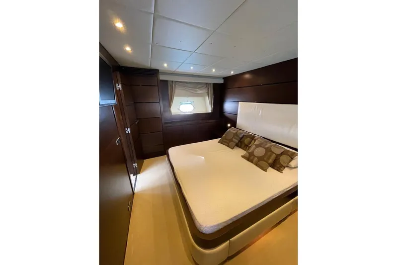 Andea Yacht Photos Pics Luxurious bedroom interior on 2008 Tecnomar Nadara 26 Fly yacht, featuring elegant wood paneling.