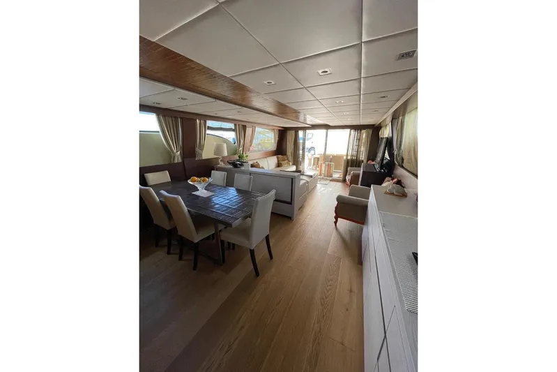 Andea Yacht Photos Pics Luxurious interior of 2008 Tecnomar Nadara 26 Fly yacht with elegant dining area.