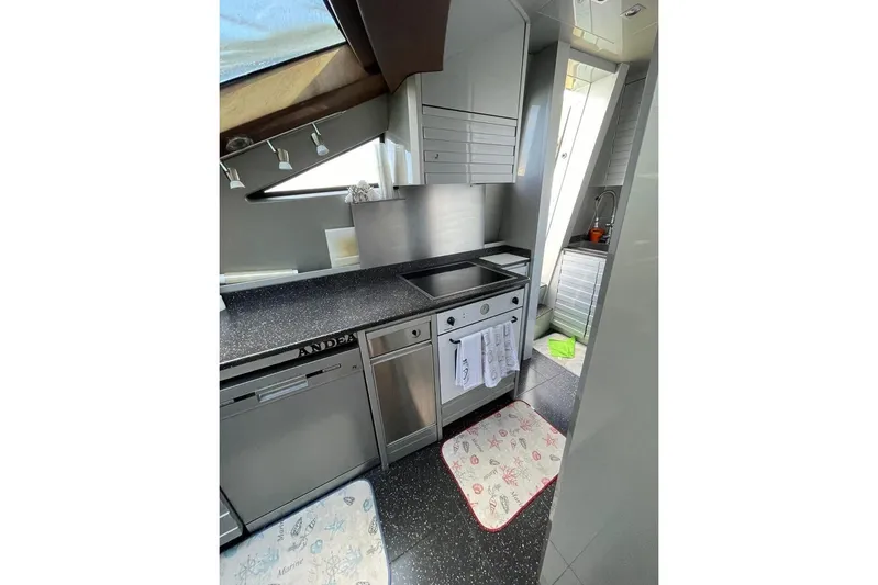 Andea Yacht Photos Pics Modern kitchen interior on 2008 Tecnomar Nadara 26 Fly yacht, featuring sleek appliances and countertops.