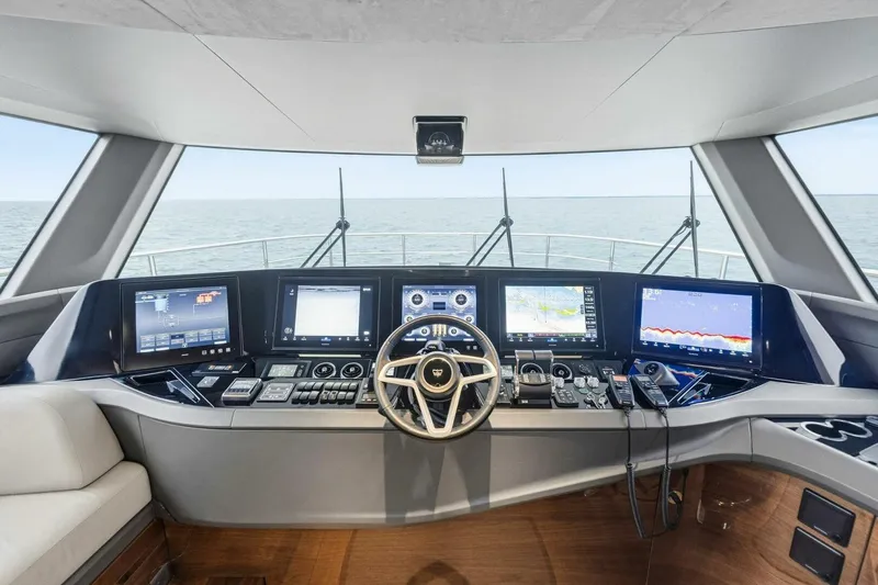 Amarula Sun Yacht Photos Pics 2024 Princess X80 yacht helm with advanced navigation displays and steering wheel.