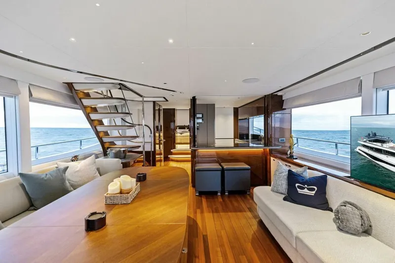 Amarula Sun Yacht Photos Pics Luxurious interior of 2024 Princess X80 yacht with elegant wood finishes and ocean view.