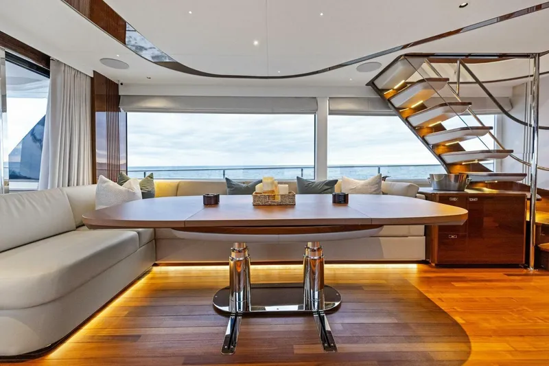 Amarula Sun Yacht Photos Pics Luxurious interior of 2024 Princess X80 yacht with elegant seating and modern staircase.