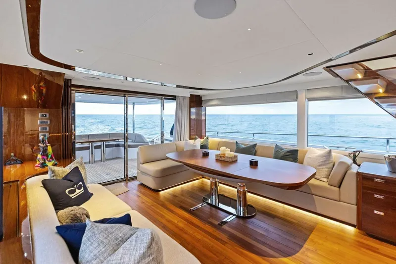 Amarula Sun Yacht Photos Pics Luxurious interior of 2024 Princess X80 yacht with ocean view and elegant seating area.