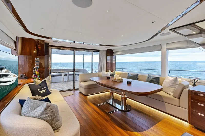 Amarula Sun Yacht Photos Pics Luxurious interior of 2024 Princess X80 yacht with ocean view and elegant seating area.