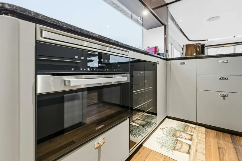 Amarula Sun Yacht Photos Pics Modern kitchen interior in 2024 Princess X80 yacht, featuring sleek appliances and elegant cabinetry.