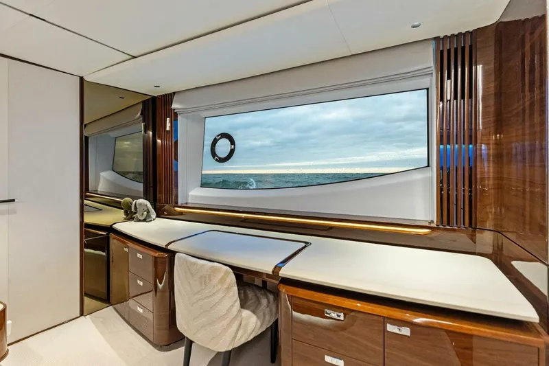 Amarula Sun Yacht Photos Pics Luxurious interior of 2024 Princess X80 yacht with ocean view through large window.