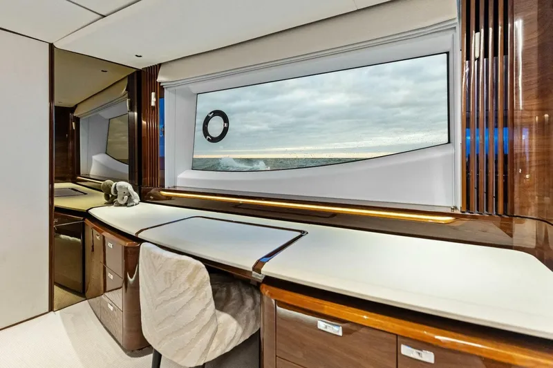 Amarula Sun Yacht Photos Pics Luxurious interior of 2024 Princess X80 yacht with ocean view through large window.