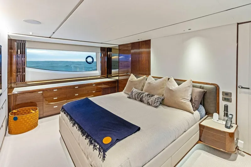 Amarula Sun Yacht Photos Pics Luxurious 2024 Princess X80 yacht bedroom with ocean view and elegant decor.