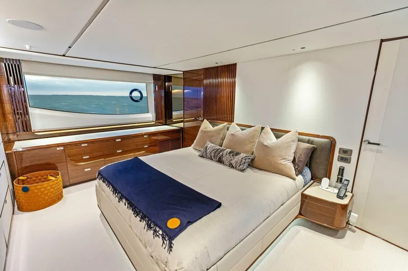 Amarula Sun Yacht Photos Pics Luxurious bedroom interior of 2024 Princess X80 yacht with ocean view.