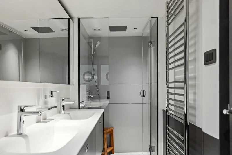 Amarula Sun Yacht Photos Pics Modern bathroom in 2024 Princess X80 yacht with sleek fixtures and glass shower.