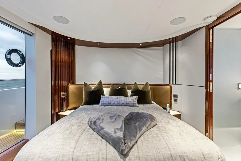 Amarula Sun Yacht Photos Pics Luxurious 2024 Princess X80 yacht bedroom with elegant decor and ocean view.
