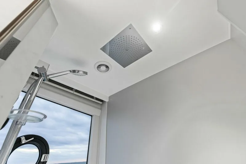 Amarula Sun Yacht Photos Pics Modern shower area in 2024 Princess X80 yacht with sleek fixtures and ceiling light.