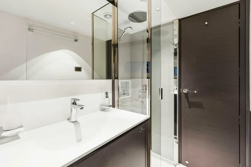 Amarula Sun Yacht Photos Pics Luxurious bathroom in 2024 Princess X80 yacht with modern fixtures and glass shower.