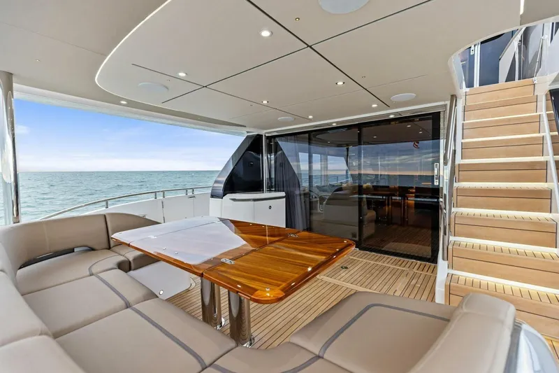 Amarula Sun Yacht Photos Pics Luxurious 2024 Princess X80 yacht deck with elegant seating and ocean view.
