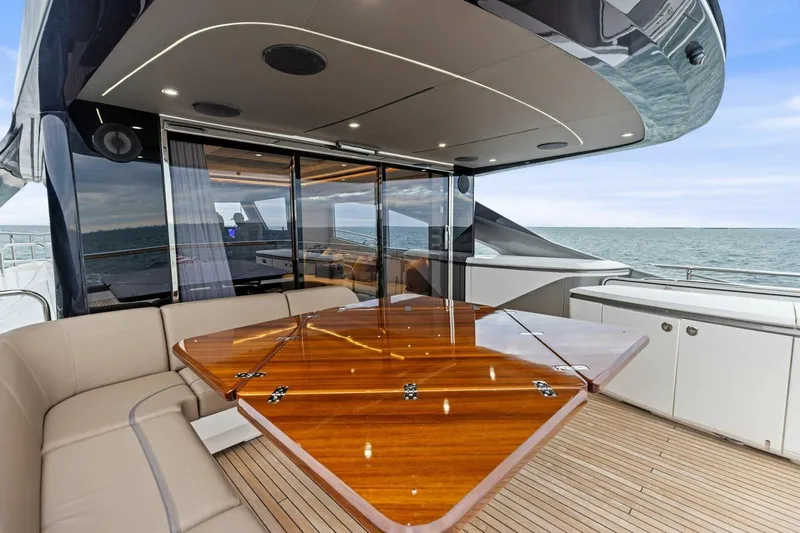 Amarula Sun Yacht Photos Pics Luxurious 2024 Princess X80 yacht deck with elegant seating and ocean view.