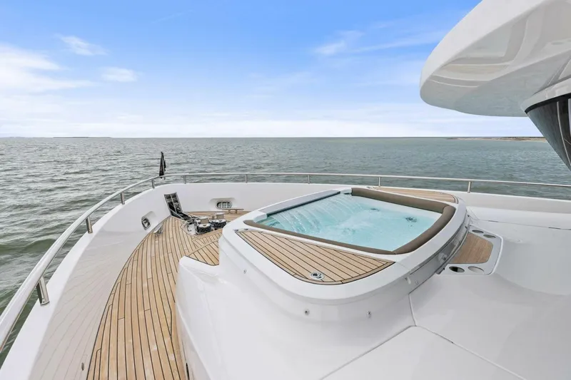 Amarula Sun Yacht Photos Pics Luxurious 2024 Princess X80 yacht deck with jacuzzi, ocean view.