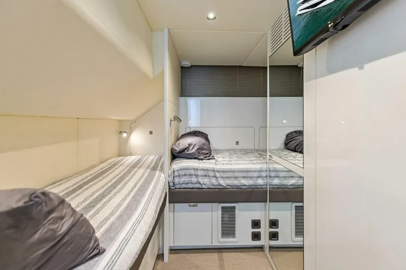 Amarula Sun Yacht Photos Pics Luxurious cabin interior of 2024 Princess X80 yacht with modern bedding and sleek design.