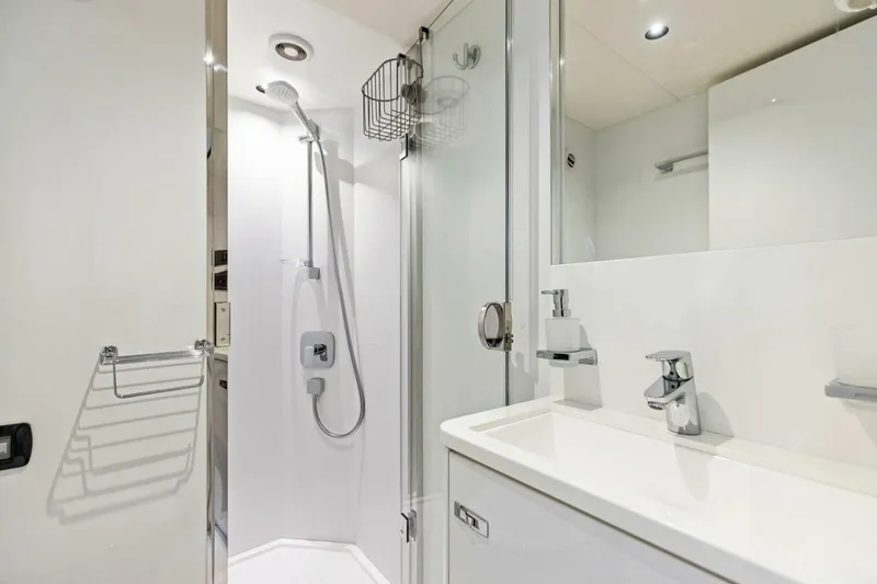 Amarula Sun Yacht Photos Pics Modern bathroom in 2024 Princess X80 yacht with sleek shower and sink design.