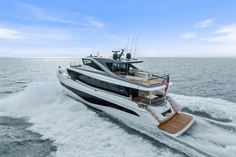 Amarula Sun Yacht Photos Pics 2024 Princess X80 yacht cruising on open sea under clear blue sky.