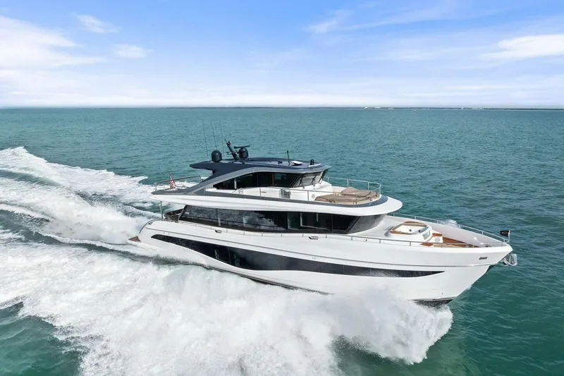 Amarula Sun Yacht Photos Pics 2024 Princess X80 yacht cruising on open sea under clear blue sky.