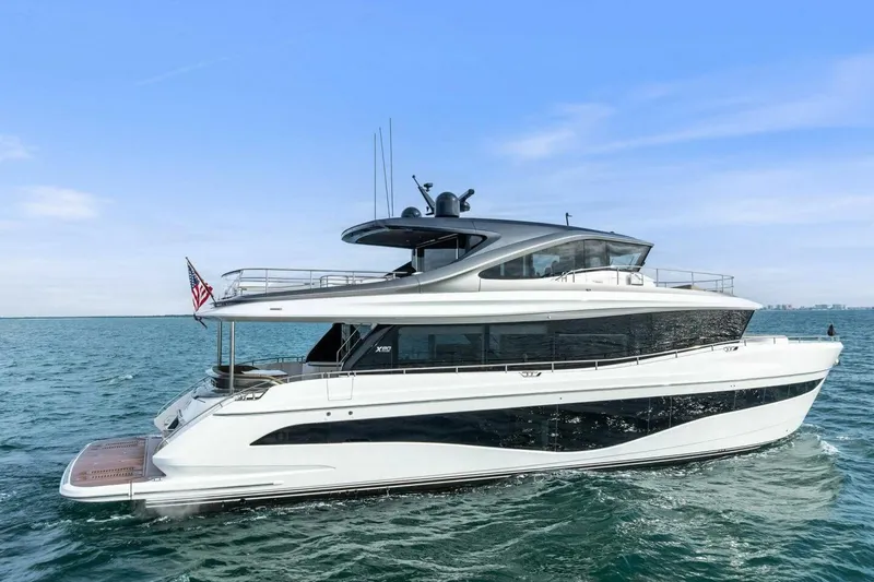 Amarula Sun Yacht Photos Pics 2024 Princess X80 yacht cruising on open water under clear blue sky.