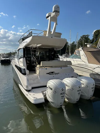 Vinovoyager Yacht Photos Pics 2021 Regal 42 FXO yacht with triple Yamaha 425 engines docked at marina.