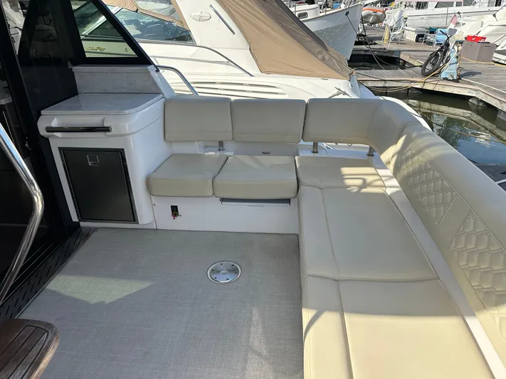 Vinovoyager Yacht Photos Pics 2021 Regal 42 FXO yacht interior with beige seating and modern design.