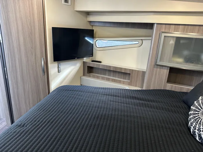 Vinovoyager Yacht Photos Pics Interior cabin of 2021 Regal 42 FXO yacht with TV and modern furnishings.