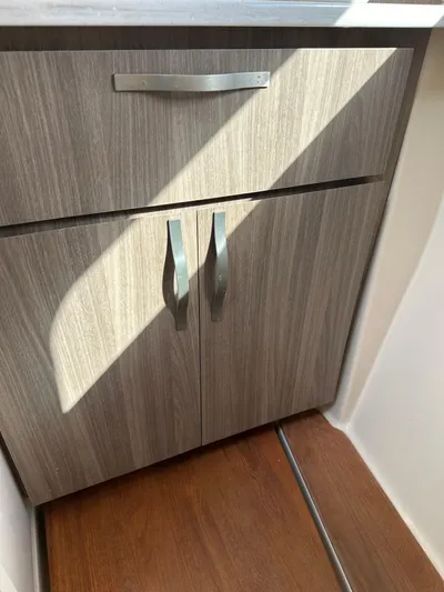 Vinovoyager Yacht Photos Pics 2021 Regal 42 FXO interior cabinet with wood finish and modern handles.