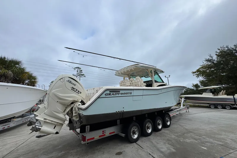  Yacht Photos Pics 2024 Grady-White Canyon 386 boat on trailer with Yamaha engines, parked outdoors.