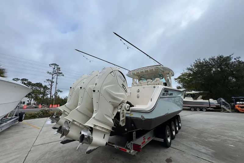  Yacht Photos Pics 2024 Grady-White Canyon 386 boat with triple outboard engines on a trailer.