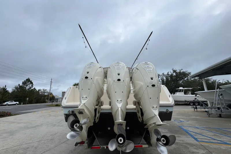  Yacht Photos Pics 2024 Grady-White Canyon 386 boat with triple 450 V8 engines, docked outdoors.