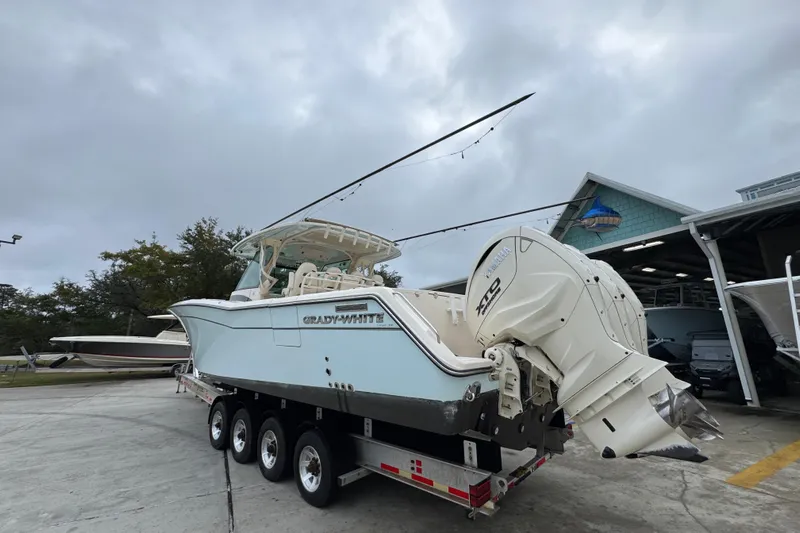 Yacht Photos Pics 2024 Grady-White Canyon 386 boat on trailer, featuring powerful outboard engines.