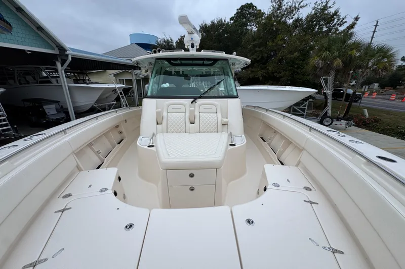  Yacht Photos Pics 2024 Grady-White Canyon 386 boat interior with seating and storage compartments.