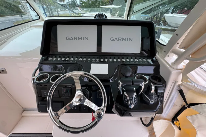  Yacht Photos Pics 2024 Grady-White Canyon 386 helm with dual Garmin displays and modern controls.