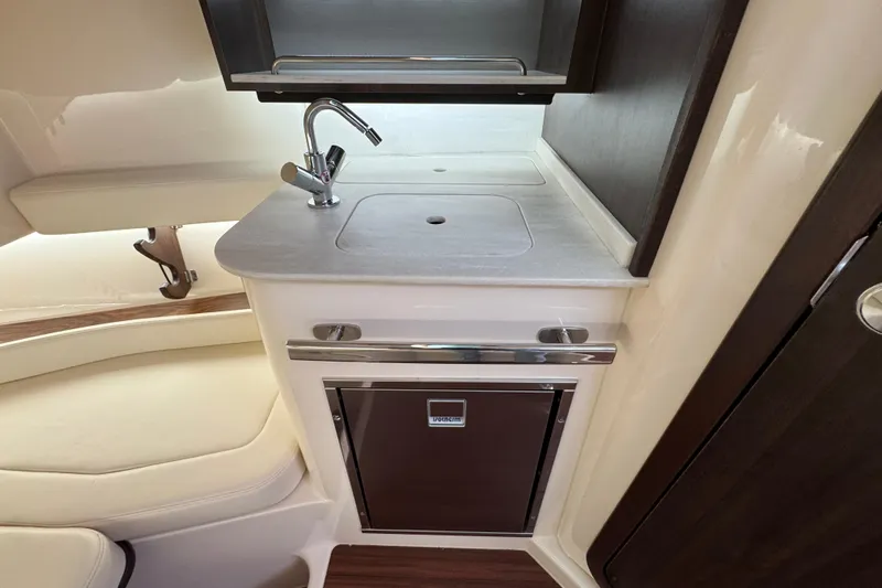  Yacht Photos Pics 2024 Grady-White Canyon 386 interior with compact kitchenette and modern sink design.