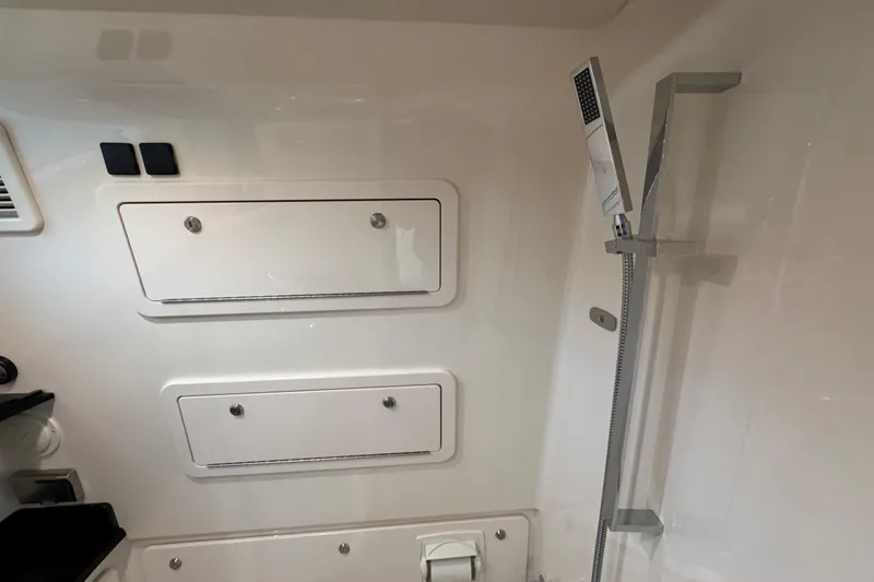  Yacht Photos Pics 2024 Grady-White Canyon 386 interior with sleek shower and storage compartments.