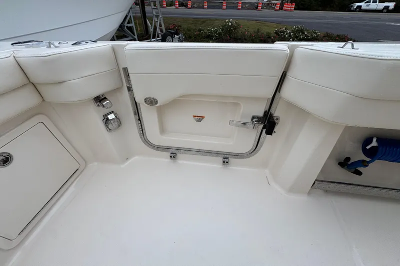  Yacht Photos Pics 2024 Grady-White Canyon 386 boat interior with storage compartments and seating.
