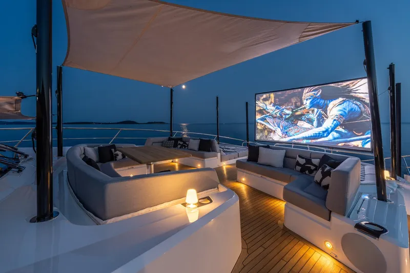 Noroader Yacht Photos Pics Luxurious 2020 Sunseeker 116 yacht deck with outdoor cinema at sunset.