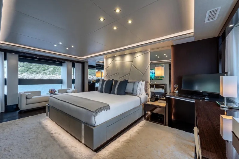 Noroader Yacht Photos Pics Luxurious bedroom interior on 2020 Sunseeker 116 yacht, featuring elegant decor and scenic views.