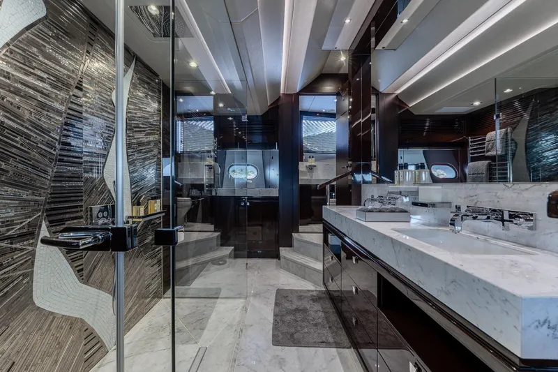 Noroader Yacht Photos Pics Luxurious bathroom interior of 2020 Sunseeker 116 yacht with marble finishes and modern design.
