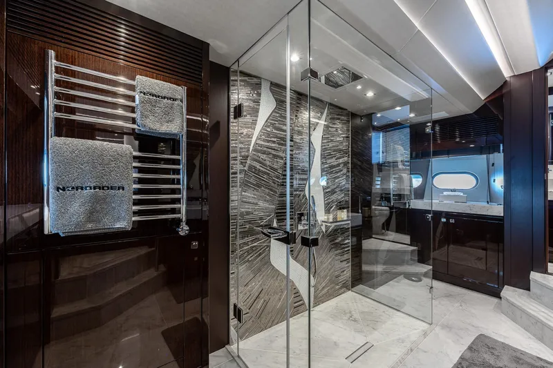 Noroader Yacht Photos Pics Luxurious bathroom on a 2020 Sunseeker 116 yacht with modern glass shower and elegant design.