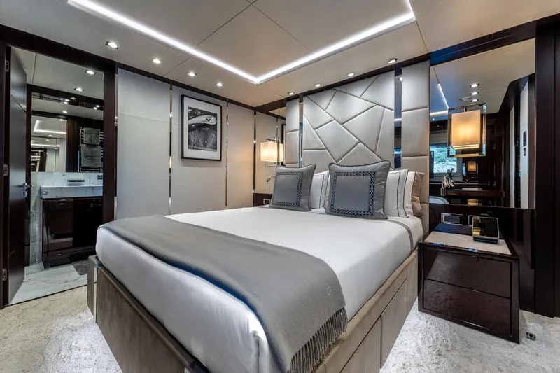 Noroader Yacht Photos Pics Luxurious bedroom interior on a 2020 Sunseeker 116 yacht, featuring elegant decor and modern amenities.