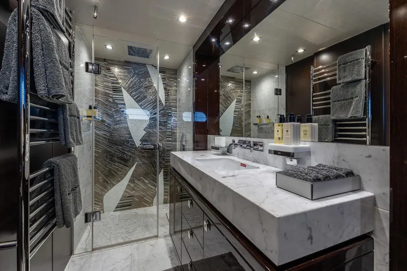 Noroader Yacht Photos Pics Luxurious Sunseeker 116 yacht bathroom with marble sink, modern shower, and plush towels, 2020 model.