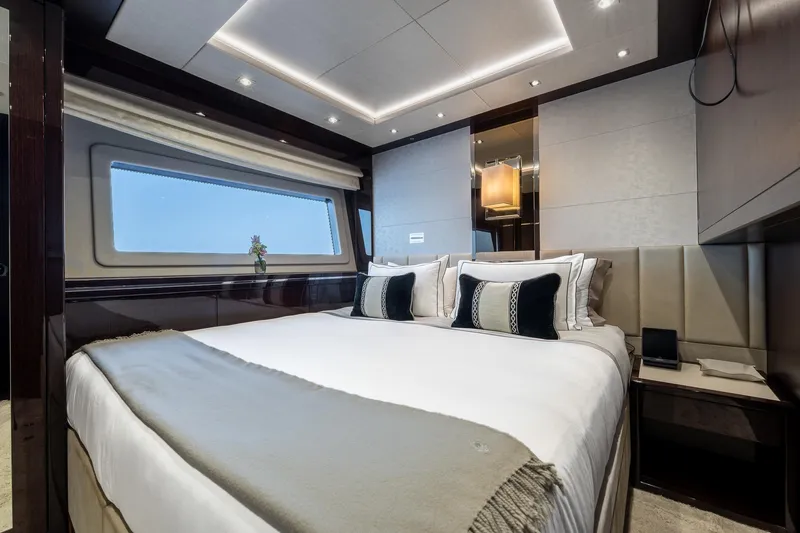 Noroader Yacht Photos Pics Luxurious bedroom interior of 2020 Sunseeker 116 yacht with modern design and large window.