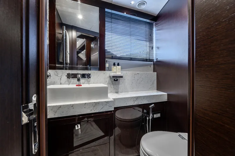 Noroader Yacht Photos Pics Luxurious bathroom on 2020 Sunseeker 116 yacht with marble sink and modern fixtures.