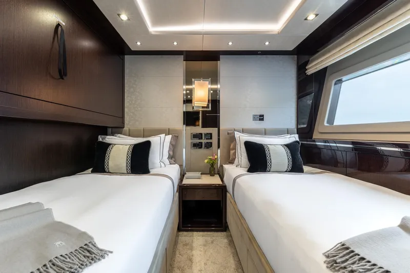 Noroader Yacht Photos Pics Luxurious twin bedroom on 2020 Sunseeker 116 yacht, featuring elegant decor and modern amenities.